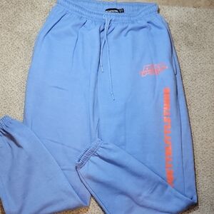 Pretty Little Thing Light Blue Sweatpants with Orange Logo